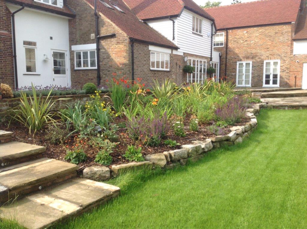 Completed garden design project in Chigwell, Essex showing contemporary planting and paving