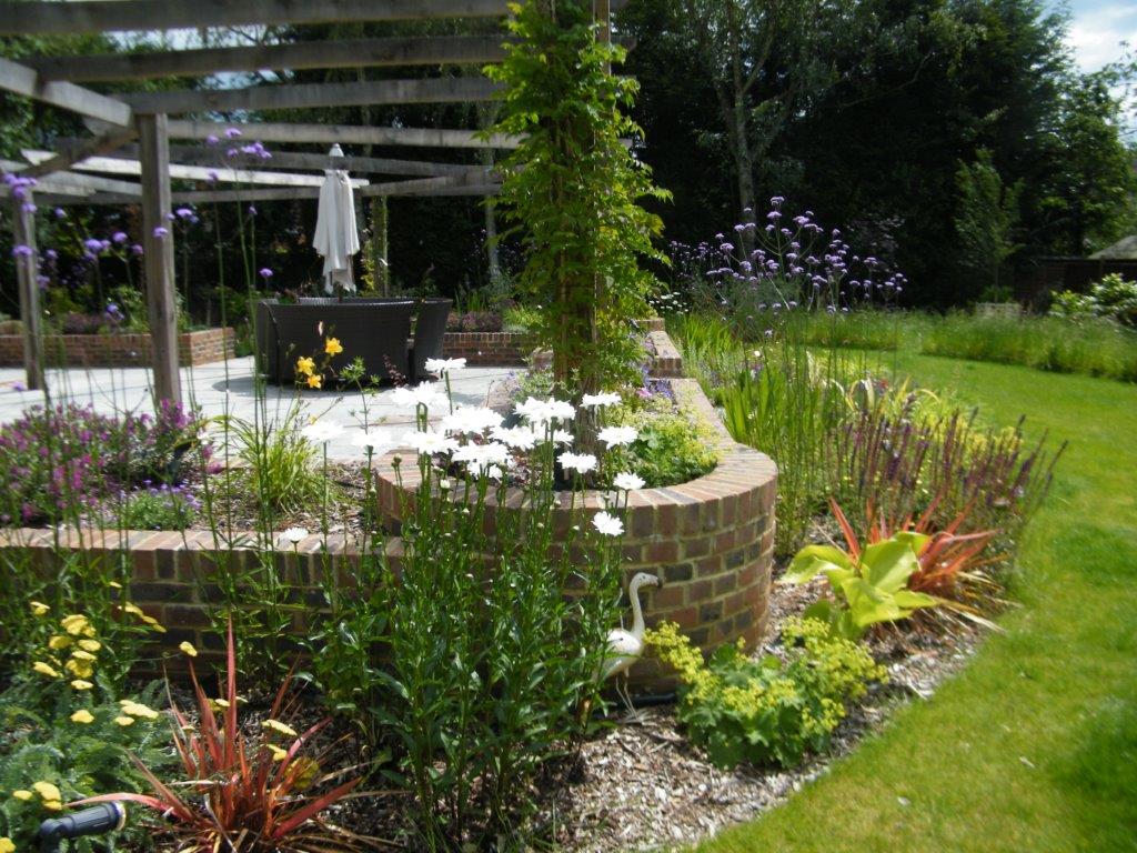 Hard landscaping project in Mottingham showing paved patio area with garden borders